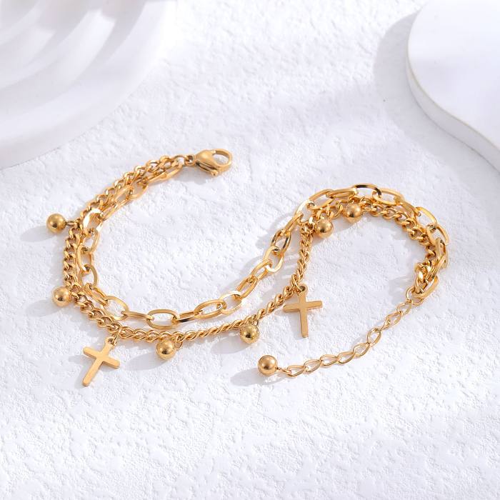 Bracelets plaqués or 24 carats en acier titane croisé de style simple de style IG