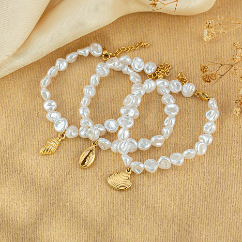 Pulseras chapadas en oro de perlas de imitación de acero inoxidable con concha de caracola de estilo simple a granel