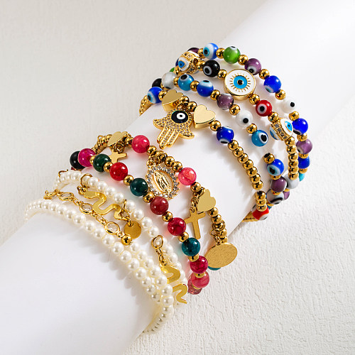 Coole Art-Kreuz-Teufelsauge-Schlangen-Edelstahl-künstliche Perle-Imitat-Perlen-vergoldete künstliche Edelstein-Armbänder im Großhandel