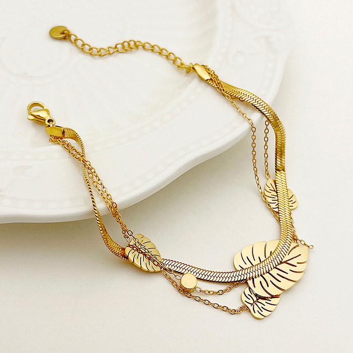 Elegante estilo simples e doce com folhas de aço inoxidável pulseiras de zircão banhadas a ouro a granel