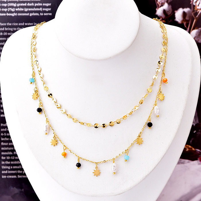 Colliers superposés de perles artificielles avec incrustation d'étoile géométrique à la mode