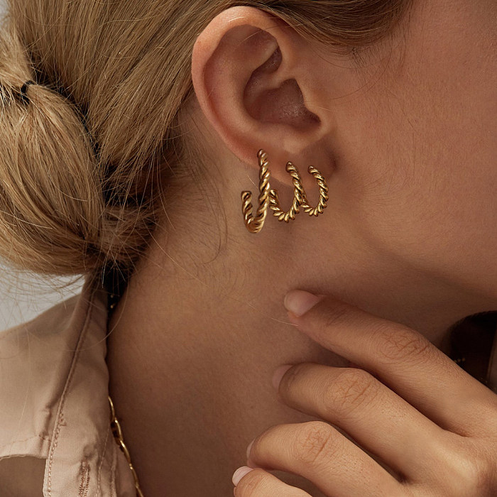 Modische Retro-Ohrringe aus 18-karätigem Gold mit Twist-Motiv aus Edelstahl