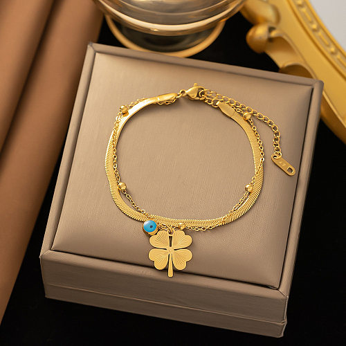 Bracelets plaqués or 18 carats avec chaîne en acier titane et œil de trèfle à quatre feuilles de style simple