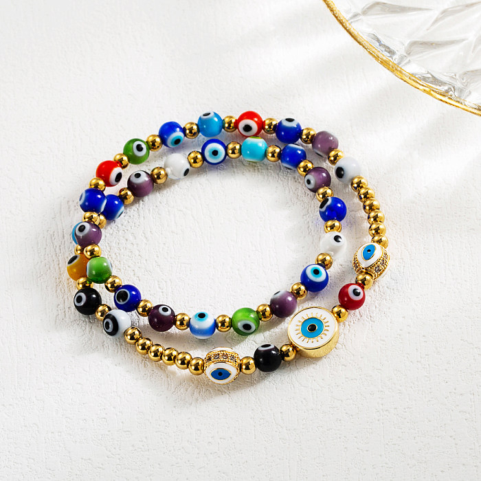 Wholesale Cool Style Cross Devil'S Eye Snake Stainless Steel Artificial Pearl Imitation Pearl Gold Plated Artificial Gemstones Bracelets