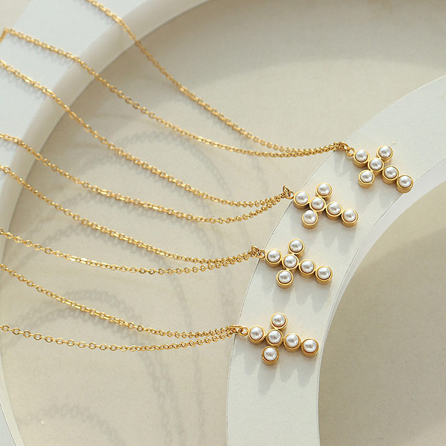 Collar con colgante de perlas artificiales con incrustaciones de acero inoxidable cruzado de estilo simple