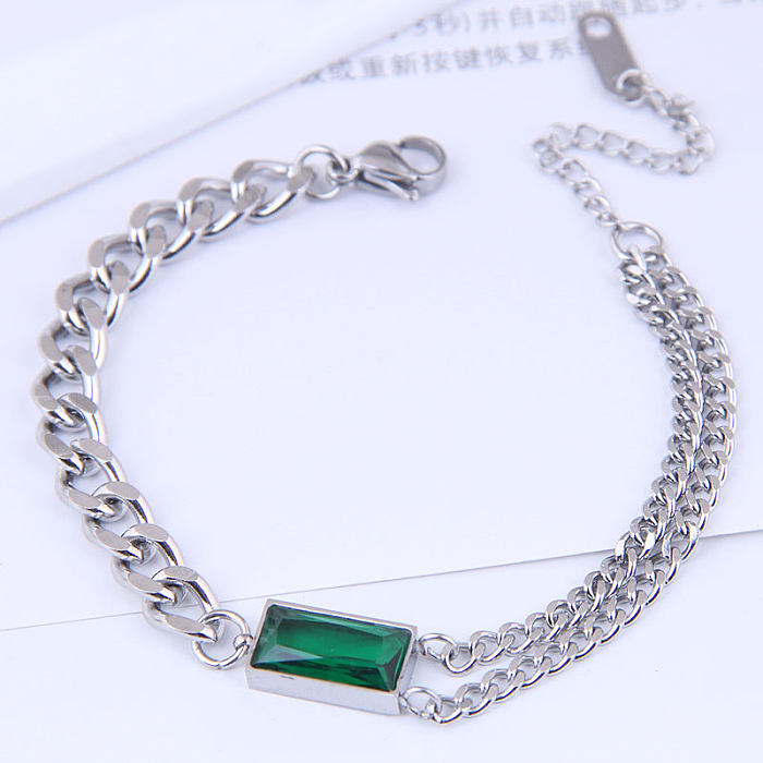 Bracelet en acier titane avec chaîne en métal simple et pierres précieuses vertes
