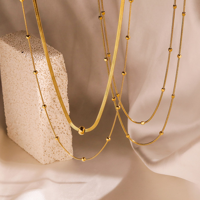 Mehrschichtige Halsketten im schlichten Stil für Pendler mit einfarbiger Edelstahlbeschichtung und 18-Karat-Vergoldung