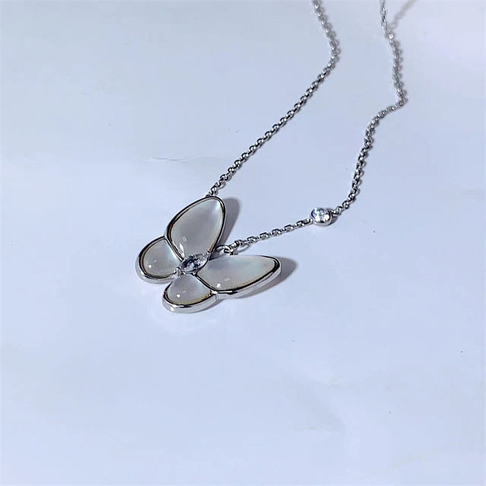Collier pendentif en agate incrusté d'acier inoxydable avec nœud papillon de style simple