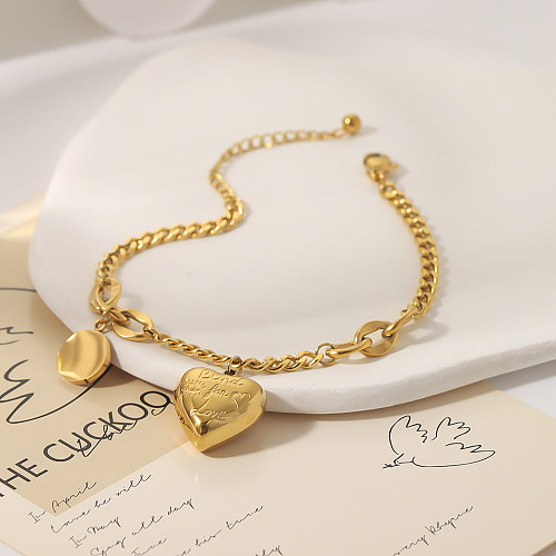 Pulseras chapadas en oro de 18K con revestimiento de acero inoxidable en forma de corazón redondo de estilo clásico de estilo moderno al por mayor