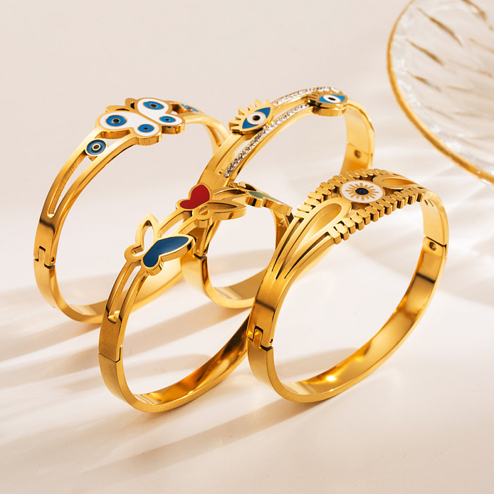 Wholesale Elegant Devil'S Eye Butterfly Stainless Steel Gold Plated Zircon Bangle