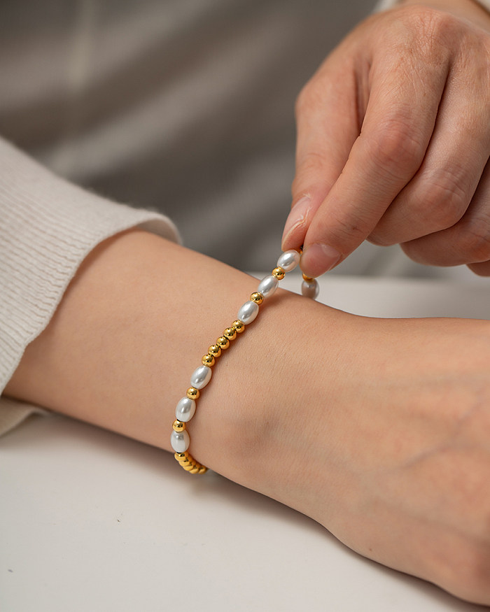 1 Stück modische runde Edelstahl-Armbänder mit Perlenbeschichtung