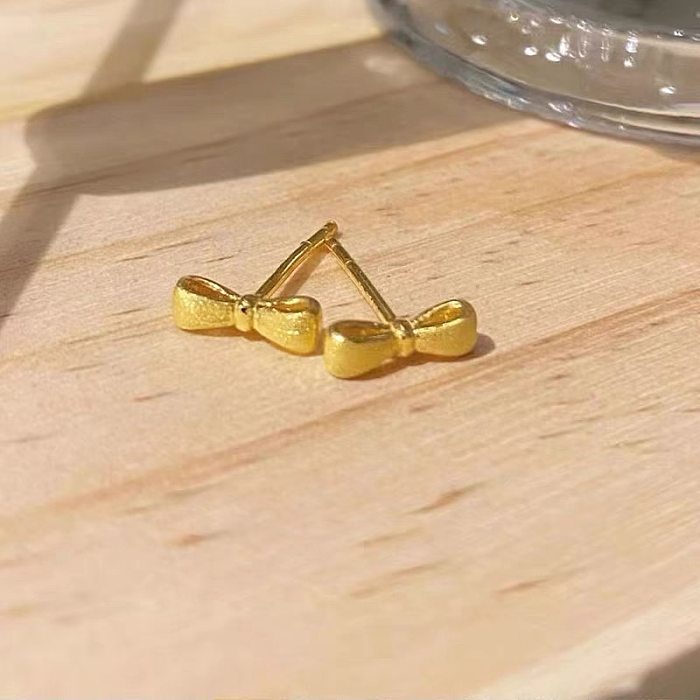 زوج واحد من ترصيع الأذن المطلي بالذهب عيار 1 قيراط والمطلي بعقدة القوس بتصميم بسيط