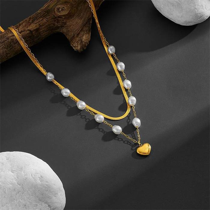 Colliers superposés de perles artificielles avec incrustation de placage en acier inoxydable en forme de cœur doux élégant