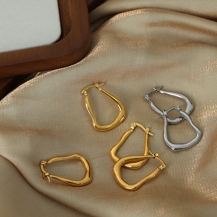 1 paire de boucles d'oreilles plaquées or 18 carats en acier inoxydable avec placage géométrique de style simple