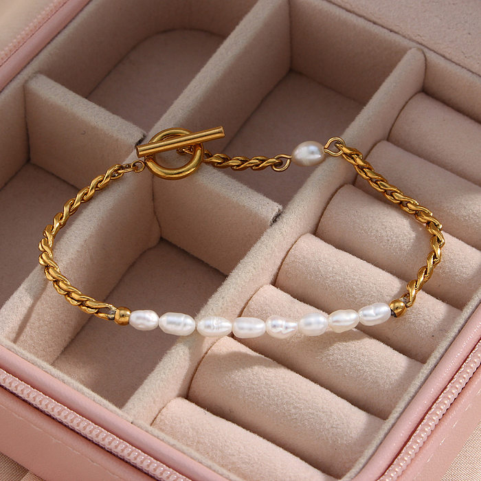 Elegante geometrische Edelstahl-Armbänder, die künstliche Perlen-Edelstahl-Armbänder überziehen