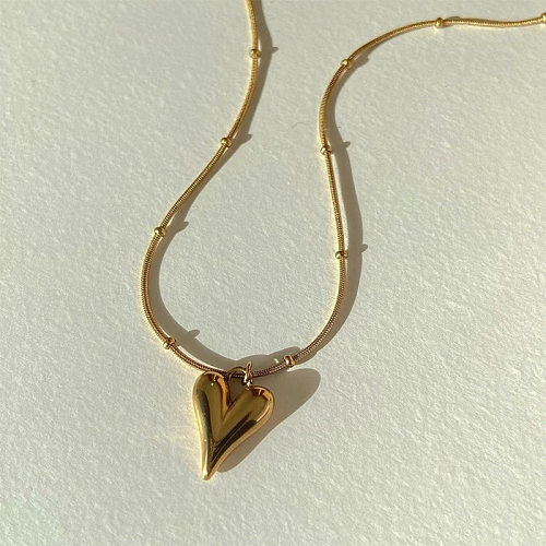 Collier en or en acier inoxydable avec pendentif en forme de cœur de pêche rétro simple
