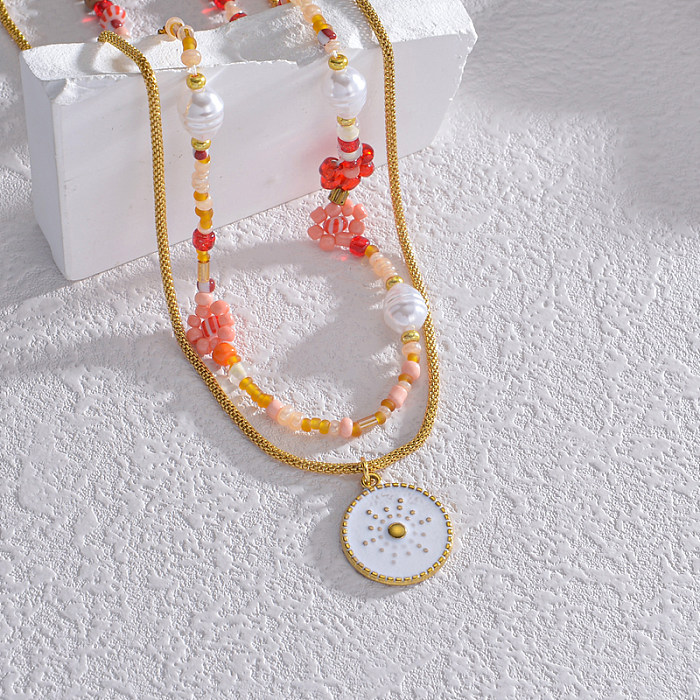 Commute Runde Edelstahl-Anhänger-Halskette mit Perlenbeschichtung und 18-Karat-Vergoldung