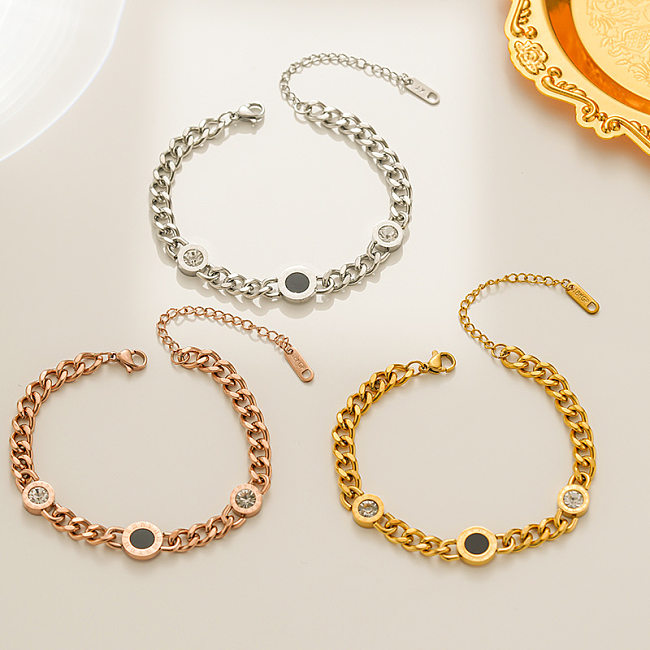 Bracelets plaqués or 18 carats avec incrustations de strass et d'acier au titane avec chiffres ronds de style INS