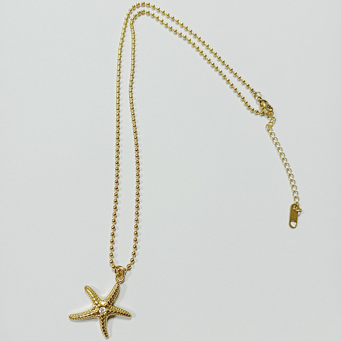 Collier plaqué or 18 carats avec incrustation de polissage et d'étoile de mer de plage en acier inoxydable