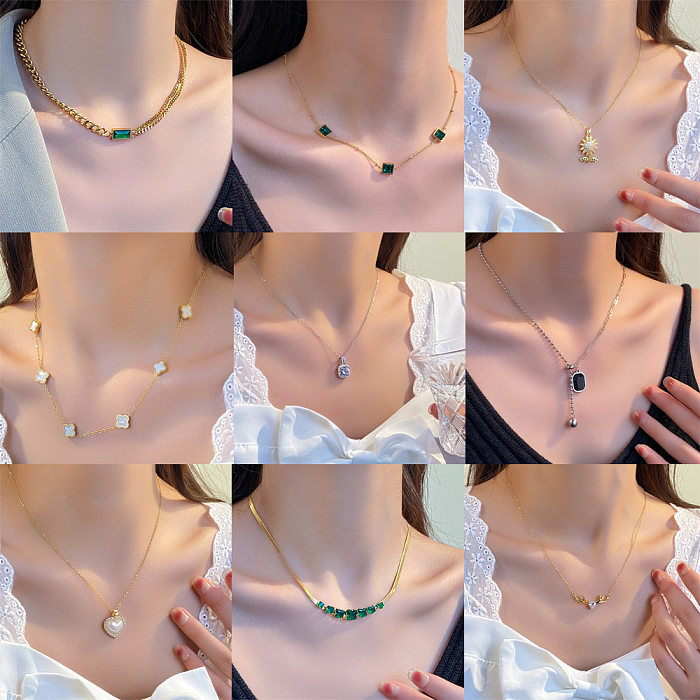 Elegante Blatt-Herzform-Schloss-Halskette mit Edelstahlüberzug und Inlay-Strasssteinen und Zirkon-Anhänger