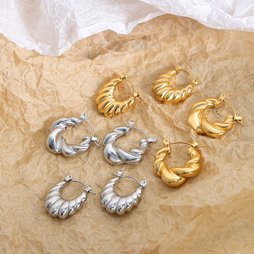 Pendientes chapados en oro de 18 quilates de acero inoxidable con revestimiento torcido de color sólido de estilo simple