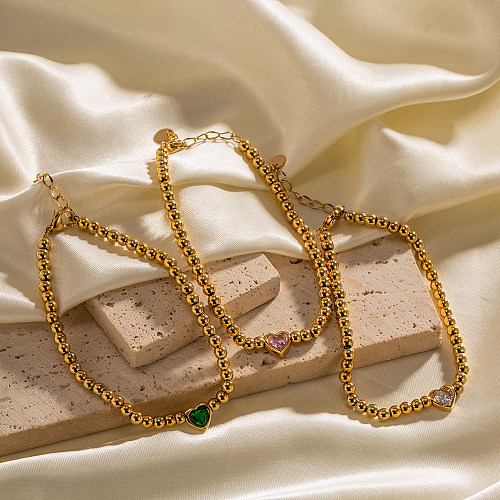 Pulseiras elegantes banhadas a ouro com zircônia embutida em aço inoxidável em forma de coração