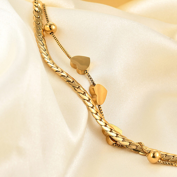 Bracelet double couche en acier titane avec chaîne à coutures en forme de cœur de style simple