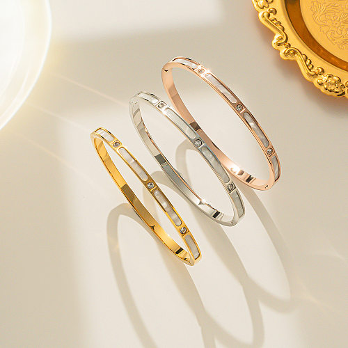 Brazalete chapado en oro de Shell de diamantes de imitación con incrustaciones de acero de titanio de color sólido de estilo simple
