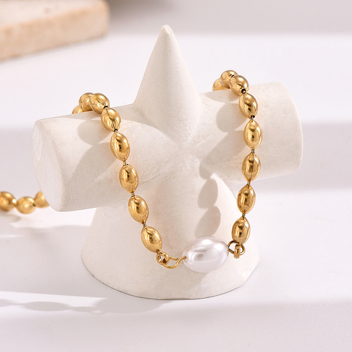Schlichte, runde Armbänder aus Edelstahl mit Perlenbeschichtung und 14-Karat-Vergoldung