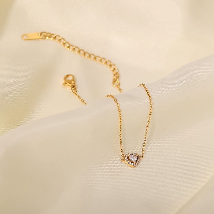 Pulseiras de aço inoxidável em formato de coração fashion com zircônias banhadas a ouro