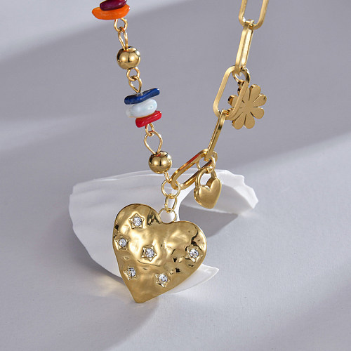 Joli collier pendentif en forme de cœur en acier inoxydable plaqué or 14 carats avec strass en vrac