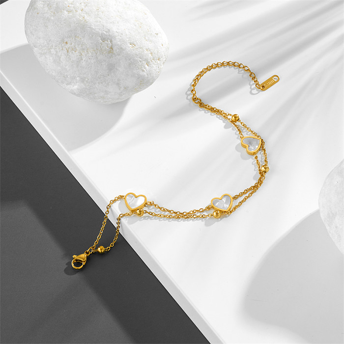 Bracelets plaqués or 18 carats avec incrustation de placage en acier titane en forme de cœur de style simple et doux