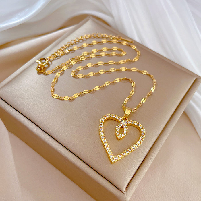 Collar con colgante de diamantes de imitación con incrustaciones de cobre y acero inoxidable en forma de corazón a la moda