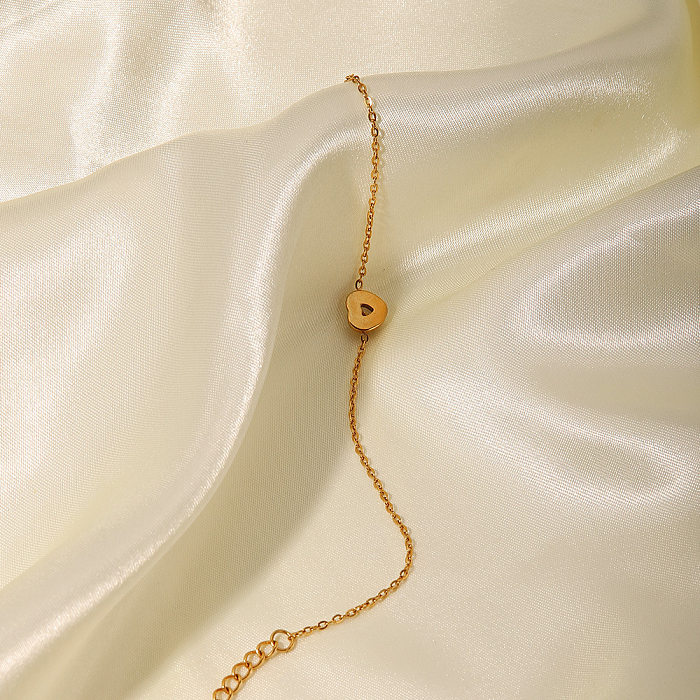 Pulseiras de aço inoxidável em formato de coração fashion com zircônias banhadas a ouro