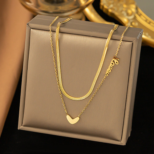 Colares em camadas banhados a ouro de aço inoxidável em formato de coração estilo streetwear simples 18K