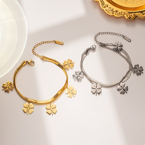 Bracelets en or incrustés d'acier de titane de trèfle à quatre feuilles de mode