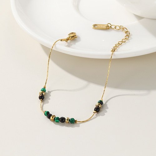 Schlichte, runde Armbänder aus Titanstahl mit Perlenbeschichtung und 14-Karat-Vergoldung