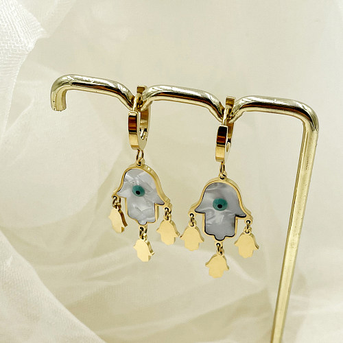 1 paire de boucles d'oreilles plaquées or avec incrustation de placage d'oeil drôle, coquille en acier inoxydable