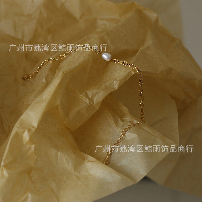 Bracelet en acier au titane avec chaîne d'épissure ovale et perle d'eau douce