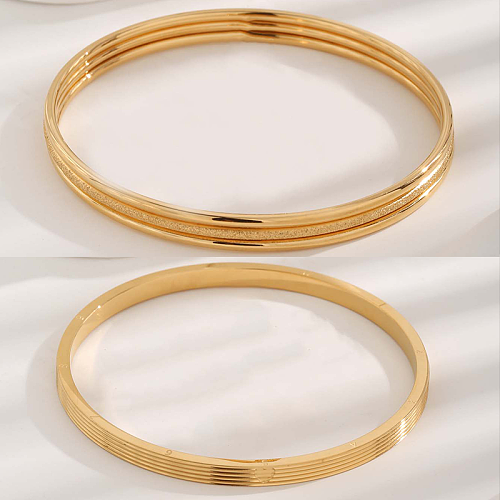 Bracelet plaqué or en acier titane avec numéro rond de style moderne