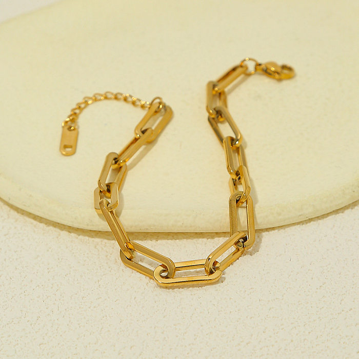 Pulseras chapadas en oro de titanio con revestimiento de acero en forma de corazón con ondas de estilo simple