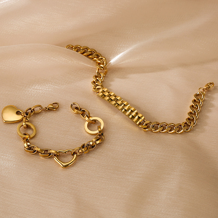 Bracelets plaqués or 18 carats en acier titanique d'oeil de forme de coeur artistique