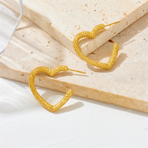 1 par de pendientes de aro chapados en oro de 18 quilates de acero inoxidable con forma de corazón para mujer