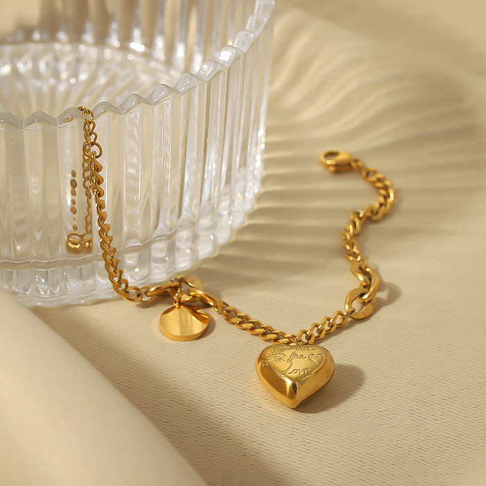 Pulseras chapadas en oro de 18K con revestimiento de acero inoxidable en forma de corazón redondo de estilo clásico de estilo moderno al por mayor
