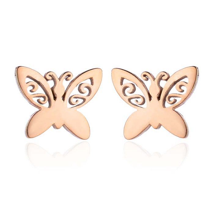 1 paire de clous d'oreilles papillon tendance en acier inoxydable.