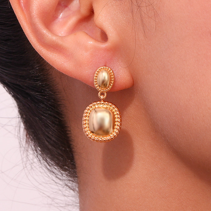 1 paire de boucles d'oreilles pendantes en acier inoxydable plaqué or 18 carats, style vintage classique, couleur unie