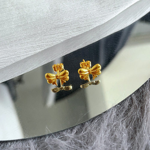 1 par de pinos de orelha banhados a ouro de aço inoxidável com nó de arco estilo simples
