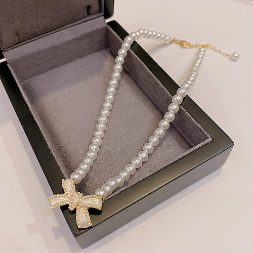 Nordischer Stil, grundlegender koreanischer Stil, Schleife, Knoten, Edelstahl-Inlay, künstliche Perlen-Halskette