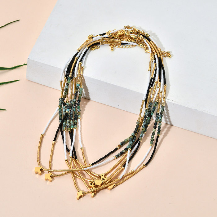 Damen-Halskette aus Edelstahl in Herzform mit türkisfarbenen Perlen