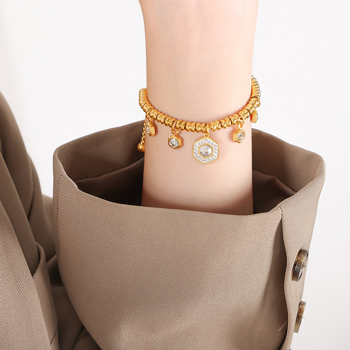 Luxuosas pulseiras de zircão banhadas a ouro 18K em formato de coração estilo britânico em aço titânio a granel